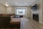 Main Level Living Room with Large Sectional & Smart TV